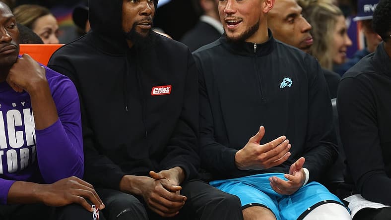 Feb 24, 2023; Phoenix, Arizona, USA; Phoenix Suns forward Kevin Durant (left) and guard Devin Booker against the Oklahoma City Thunder in the second half at Footprint Center. Mandatory Credit: Mark J. Rebilas-USA TODAY Sports