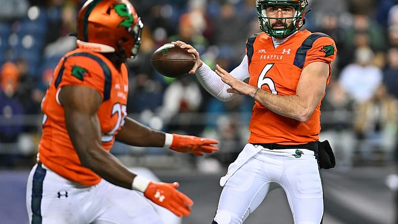 Feb 23, 2023; Seattle, WA, USA; Seattle Sea Dragons quarterback Ben DiNucci (6) and Seattle Sea Dragons running back Morgan Ellison (25) during the second half at Lumen Field. St. Louis defeated Seattle 20-18. Mandatory Credit: Steven Bisig-USA TODAY Sports