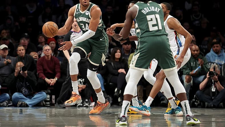 Feb 28, 2023; Brooklyn, New York, USA; Milwaukee Bucks forward Giannis Antetokounmpo (34) looks to pass the ball to guard Jrue Holiday (21) during the first quarter against the Brooklyn Nets at Barclays Center. Mandatory Credit: Brad Penner-USA TODAY Sports
