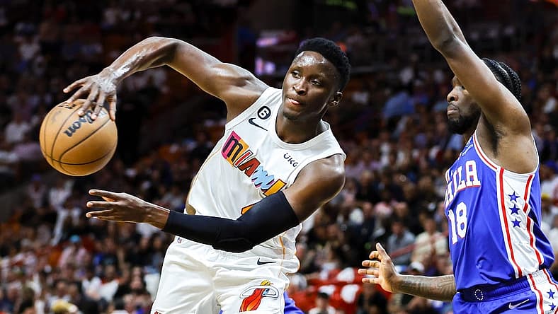 Mar 1, 2023; Miami, Florida, USA; Miami Heat guard Victor Oladipo (4) passes the basketball as Philadelphia 76ers guard Shake Milton (18) defends during the second quarter at Miami-Dade Arena. Mandatory Credit: Sam Navarro-USA TODAY Sports