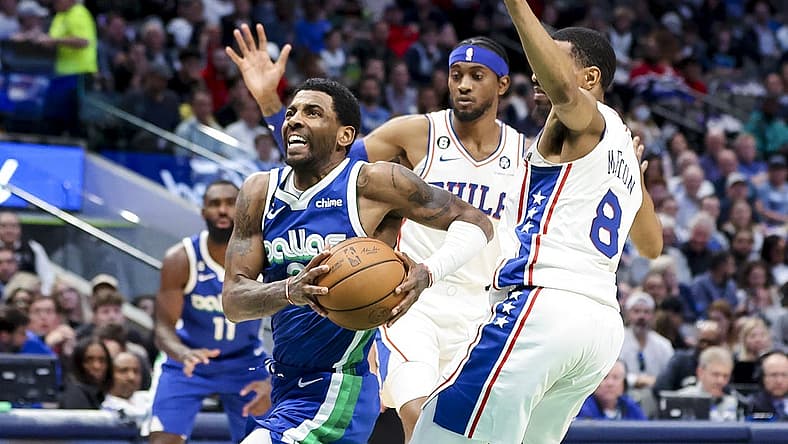 Mar 2, 2023; Dallas, Texas, USA;  Dallas Mavericks guard Kyrie Irving (2) drives to the basket past Philadelphia 76ers guard De'Anthony Melton (8) during the second quarter at American Airlines Center. Mandatory Credit: Kevin Jairaj-USA TODAY Sports