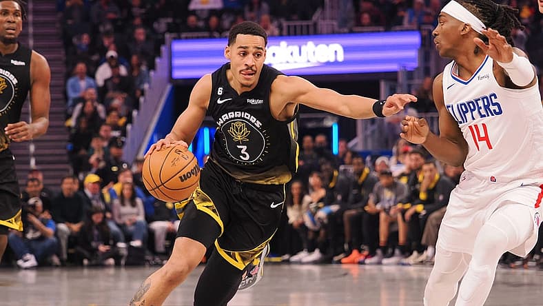 Mar 2, 2023; San Francisco, California, USA; Golden State Warriors guard Jordan Poole (3) drives in against Los Angeles Clippers shooting guard Terance Mann (14) during the first quarter at Chase Center. Mandatory Credit: Kelley L Cox-USA TODAY Sports