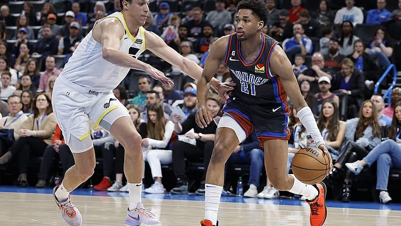 Mar 3, 2023; Oklahoma City, Oklahoma, USA; Oklahoma City Thunder guard Aaron Wiggins (21) drives to the basket against Utah Jazz forward Simone Fontecchio (16) during the second quarter at Paycom Center. Mandatory Credit: Alonzo Adams-USA TODAY Sports