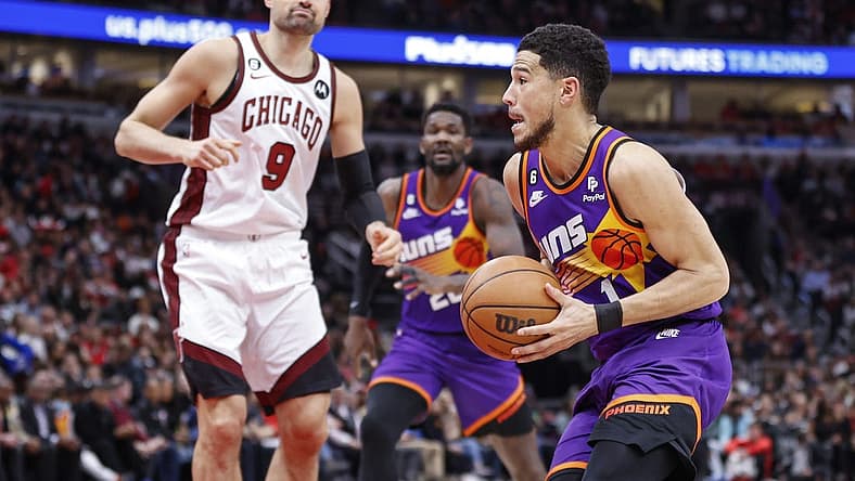 Mar 3, 2023; Chicago, Illinois, USA; Phoenix Suns guard Devin Booker (1) drives to the basket against the Chicago Bulls during the first half at United Center. Mandatory Credit: Kamil Krzaczynski-USA TODAY Sports