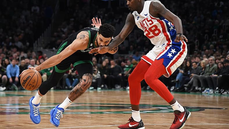 Mar 3, 2023; Boston, Massachusetts, USA; Brooklyn Nets forward Dorian Finney-Smith (28) defends Boston Celtics forward Jayson Tatum (0) during the first half at TD Garden. Mandatory Credit: Bob DeChiara-USA TODAY Sports
