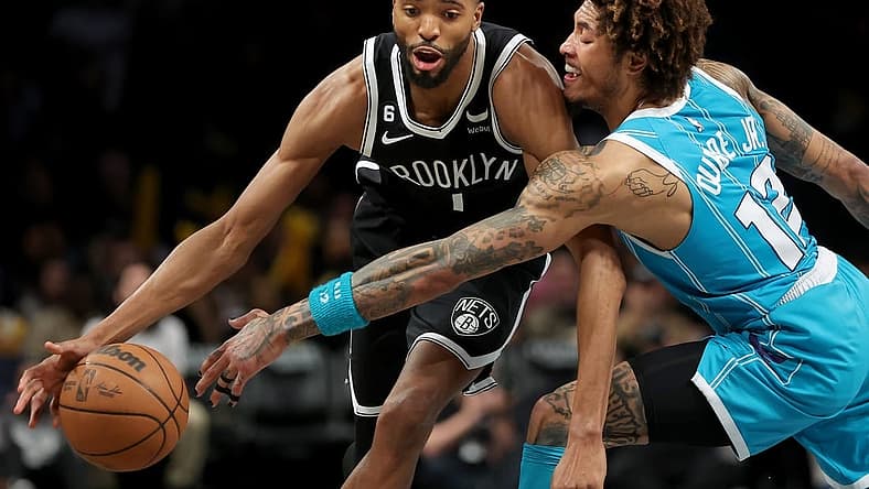 Mar 5, 2023; Brooklyn, New York, USA; Brooklyn Nets forward Mikal Bridges (1) drives to the basket against Charlotte Hornets guard Kelly Oubre Jr. (12) during the fourth quarter at Barclays Center. Mandatory Credit: Brad Penner-USA TODAY Sports