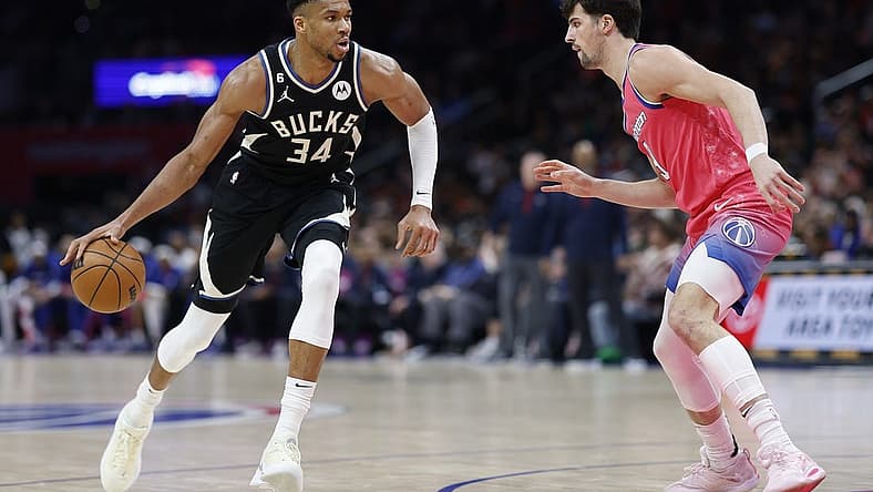 Mar 5, 2023; Washington, District of Columbia, USA; Milwaukee Bucks forward Giannis Antetokounmpo (34) drives to the basket as Washington Wizards forward Corey Kispert (24) defends in the fourth quarter at Capital One Arena. Mandatory Credit: Geoff Burke-USA TODAY Sports