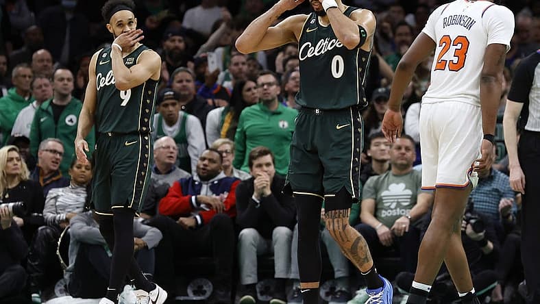 Mar 5, 2023; Boston, Massachusetts, USA; Boston Celtics forward Jayson Tatum (0) and guard Derrick White (9) react to a foul being called against the Celtics during the overtime period against the New York Knicks at TD Garden. Mandatory Credit: Winslow Townson-USA TODAY Sports