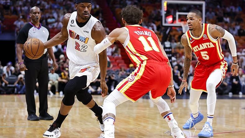 Mar 6, 2023; Miami, Florida, USA; Miami Heat forward Jimmy Butler (22) dribbles the basketball as Atlanta Hawks guard Trae Young (11) defends during the first quarter at Miami-Dade Arena. Mandatory Credit: Sam Navarro-USA TODAY Sports
