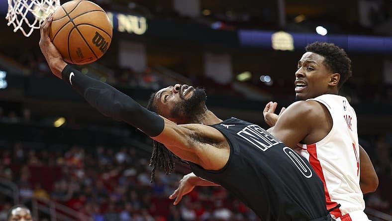 Mar 7, 2023; Houston, Texas, USA; Brooklyn Nets center Nerlens Noel (0) attempts to grab a rebound away from Houston Rockets forward Jae'Sean Tate (8) during the first quarter at Toyota Center. Mandatory Credit: Troy Taormina-USA TODAY Sports