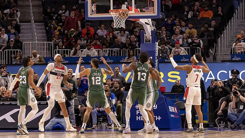 Mar 7, 2023; Detroit, Michigan, USA; Washington Wizards center Daniel Gafford (21) shoots the game winning basket as time runs out against the Detroit Pistons in the fourth quarter at Little Caesars Arena. Mandatory Credit: David Reginek-USA TODAY Sports