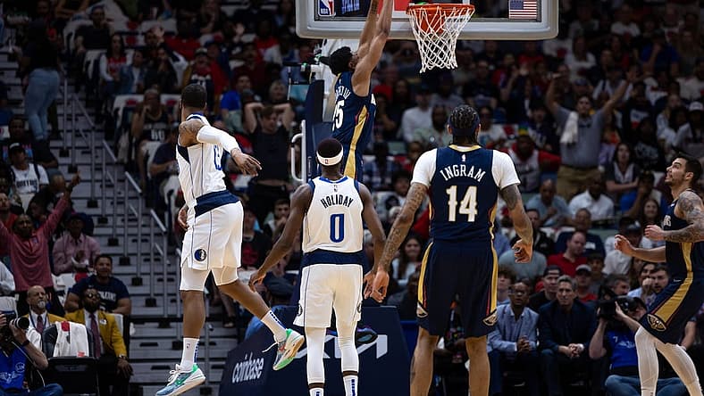Mar 8, 2023; New Orleans, Louisiana, USA; New Orleans Pelicans guard Trey Murphy III (25) dunks the ball against Dallas Mavericks forward Markieff Morris (13) during the first half at Smoothie King Center. Mandatory Credit: Stephen Lew-USA TODAY Sports