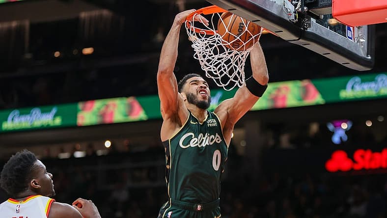 Mar 11, 2023; Atlanta, Georgia, USA; Boston Celtics forward Jayson Tatum (0) dunks against the Atlanta Hawks in the first quarter at State Farm Arena. Mandatory Credit: Brett Davis-USA TODAY Sports