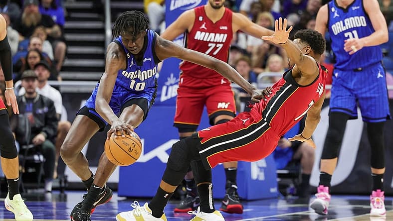 Mar 11, 2023; Orlando, Florida, USA; Orlando Magic center Bol Bol (10) handles the ball against Miami Heat guard Kyle Lowry (7) during the second quarter at Amway Center. Mandatory Credit: Mike Watters-USA TODAY Sports