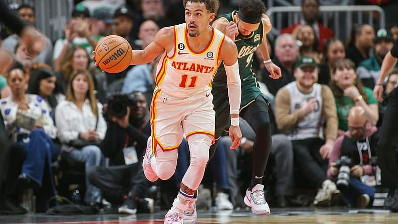 Mar 11, 2023; Atlanta, Georgia, USA; Atlanta Hawks guard Trae Young (11) dribbles against the Boston Celtics in the second half at State Farm Arena. Mandatory Credit: Brett Davis-USA TODAY Sports