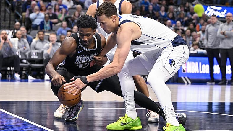 Mar 13, 2023; Dallas, Texas, USA; Memphis Grizzlies forward Jaren Jackson Jr. (13) and Dallas Mavericks center Dwight Powell (7) battle for control of the loose ball during the second quarter at the American Airlines Center. Mandatory Credit: Jerome Miron-USA TODAY Sports