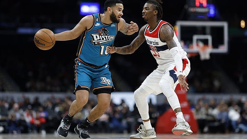 Mar 14, 2023; Washington, District of Columbia, USA; Detroit Pistons guard Cory Joseph (18) dribbles the ball as Washington Wizards guard Delon Wright (55) defends in the second quarter at Capital One Arena. Mandatory Credit: Geoff Burke-USA TODAY Sports