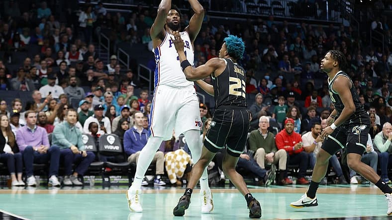 Mar 17, 2023; Charlotte, North Carolina, USA; Philadelphia 76ers center Joel Embiid (21) shoots over Charlotte Hornets forward Kai Jones (23) during the first half at Spectrum Center. Mandatory Credit: Brian Westerholt-USA TODAY Sports