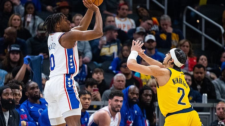 Mar 18, 2023; Indianapolis, Indiana, USA; Philadelphia 76ers guard Tyrese Maxey (0) shoots the ball while Indiana Pacers guard Andrew Nembhard (2) defends in the second quarter at Gainbridge Fieldhouse. Mandatory Credit: Trevor Ruszkowski-USA TODAY Sports