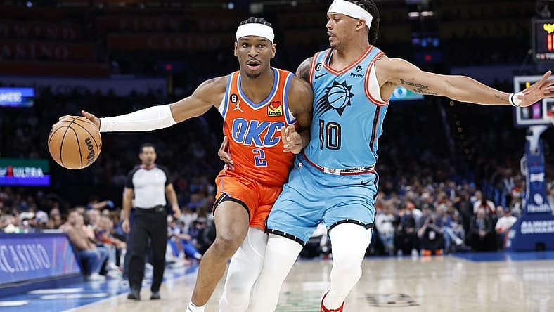 Mar 19, 2023; Oklahoma City, Oklahoma, USA; Oklahoma City Thunder guard Shai Gilgeous-Alexander (2) drives against Phoenix Suns guard Damion Lee (10) during the second quarter at Paycom Center. Mandatory Credit: Alonzo Adams-USA TODAY Sports