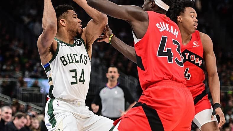 Mar 19, 2023; Milwaukee, Wisconsin, USA; Milwaukee Bucks forward Giannis Antetokounmpo (34) looks for a shot against Toronto Raptors forward Pascal Siakam (43) in the first quarter at Fiserv Forum. Mandatory Credit: Benny Sieu-USA TODAY Sports