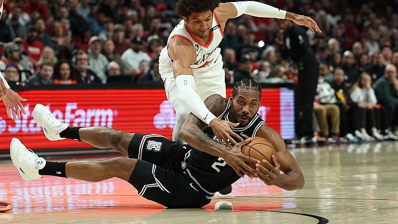 Mar 19, 2023; Portland, Oregon, USA; Portland Trail Blazers forward Greg Brown III (4) defends LA Clippers forward Kawhi Leonard (2) in the first half at Moda Center. Mandatory Credit: Jaime Valdez-USA TODAY Sports