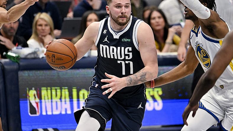 Mar 22, 2023; Dallas, Texas, USA; Dallas Mavericks guard Luka Doncic (77) drives to the basket against the Golden State Warriors during the second half at the American Airlines Center. Mandatory Credit: Jerome Miron-USA TODAY Sports