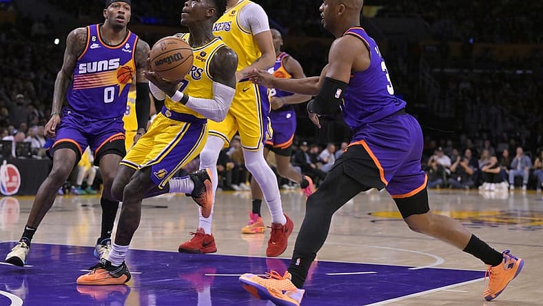 Mar 22, 2023; Los Angeles, California, USA; Los Angeles Lakers guard Dennis Schroder (17) drives past Phoenix Suns guard Chris Paul (3) in the first half at Crypto.com Arena. Mandatory Credit: Jayne Kamin-Oncea-USA TODAY Sports