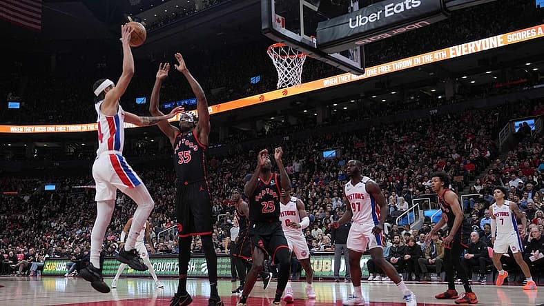 Mar 24, 2023; Toronto, Ontario, CAN; Detroit Pistons guard R.J. Hampton (14) drives to the basket as Toronto Raptors center Christian Koloko (35) tries to defend during the second quarter at Scotiabank Arena. Mandatory Credit: Nick Turchiaro-USA TODAY Sports
