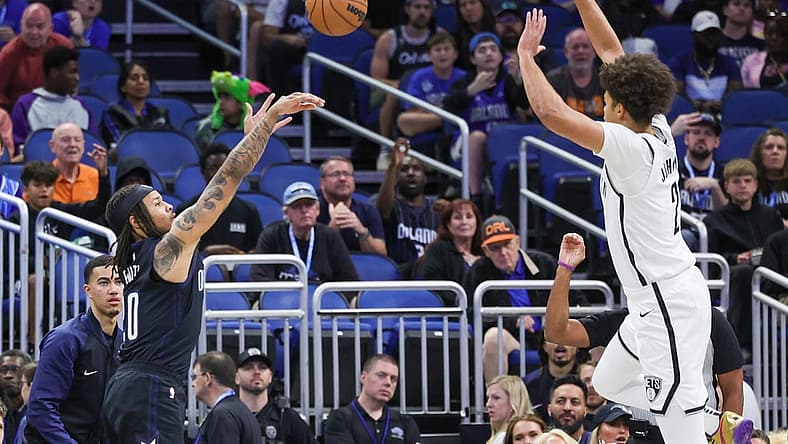 Mar 26, 2023; Orlando, Florida, USA; Orlando Magic guard Markelle Fultz (20) shoots the ball against Brooklyn Nets forward Cameron Johnson (2) during the first quarter at Amway Center. Mandatory Credit: Mike Watters-USA TODAY Sports
