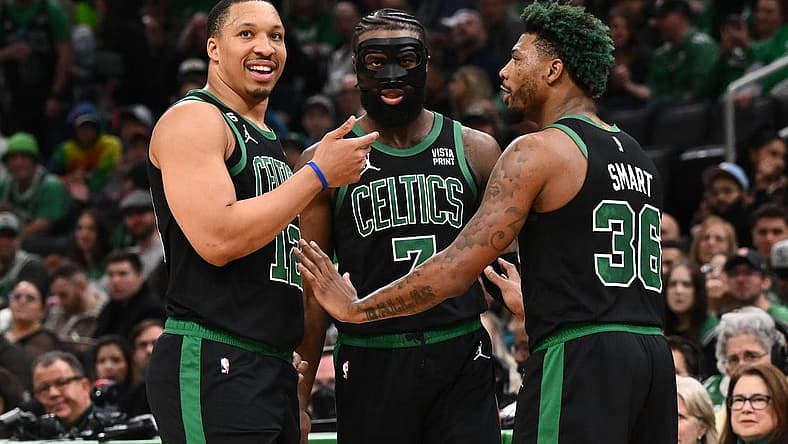 Mar 26, 2023; Boston, Massachusetts, USA; Boston Celtics forward Grant Williams (12), guard Jaylen Brown (7), and guard Marcus Smart (36) talk during a timeout during a game against the San Antonio Spurs at the TD Garden. Mandatory Credit: Brian Fluharty-USA TODAY Sports