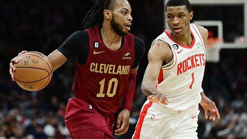 Mar 26, 2023; Cleveland, Ohio, USA; Cleveland Cavaliers guard Darius Garland (10) drives to the basket against Houston Rockets forward Jabari Smith Jr. (1) during the second half at Rocket Mortgage FieldHouse. Mandatory Credit: Ken Blaze-USA TODAY Sports
