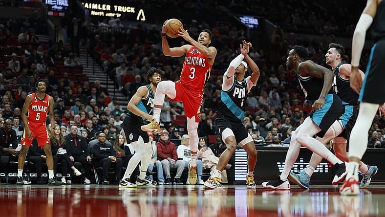 Mar 27, 2023; Portland, Oregon, USA; New Orleans Pelicans shooting guard CJ McCollum (3) drives to the basket past Portland Trail Blazers shooting guard Keon Johnson (6) during the first half at Moda Center. Mandatory Credit: Soobum Im-USA TODAY Sports
