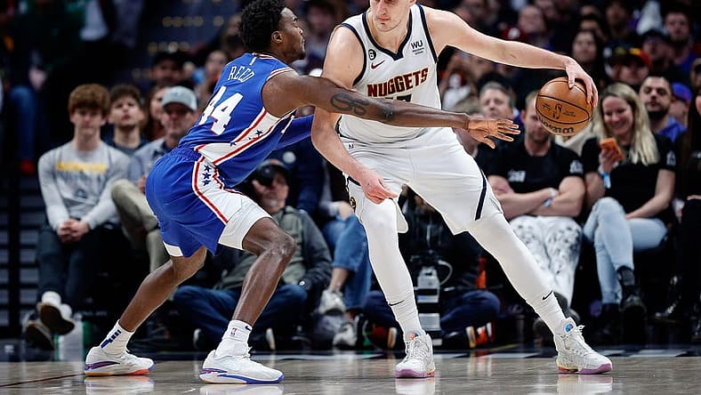 Mar 27, 2023; Denver, Colorado, USA; Denver Nuggets center Nikola Jokic (15) controls the ball as Philadelphia 76ers forward Paul Reed (44) guards in the third quarter at Ball Arena. Mandatory Credit: Isaiah J. Downing-USA TODAY Sports