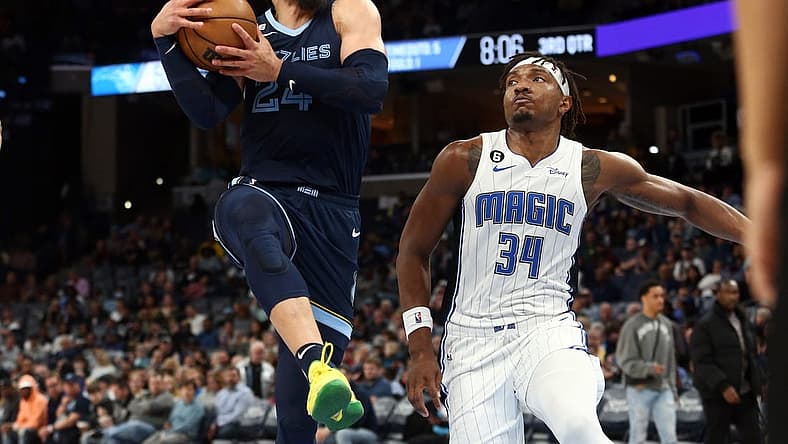 Mar 28, 2023; Memphis, Tennessee, USA; Memphis Grizzlies forward Dillon Brooks (24) drives to the basket as Orlando Magic center Wendell Carter Jr. (34) defends during the second half at FedExForum. Mandatory Credit: Petre Thomas-USA TODAY Sports
