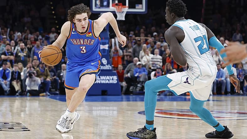Mar 28, 2023; Oklahoma City, Oklahoma, USA; Oklahoma City Thunder guard Josh Giddey (3) drives to the basket against Charlotte Hornets forward JT Thor (21) during the second half at Paycom Center. Charlotte won 137-134. Mandatory Credit: Alonzo Adams-USA TODAY Sports