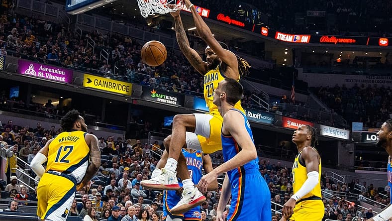 Mar 31, 2023; Indianapolis, Indiana, USA; Indiana Pacers forward Isaiah Jackson (22) shoots the ball while Oklahoma City Thunder forward Aleksej Pokusevski (17) defends in the first quarter at Gainbridge Fieldhouse. Mandatory Credit: Trevor Ruszkowski-USA TODAY Sports