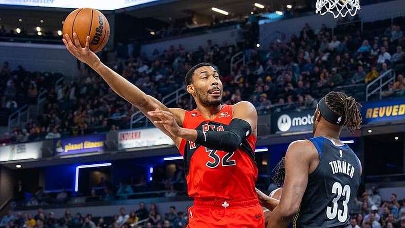 Nov 12, 2022; Indianapolis, Indiana, USA; Toronto Raptors forward Otto Porter Jr. (32) shoots the ball while Indiana Pacers center Myles Turner (33) defends in the first quarter at Gainbridge Fieldhouse. Mandatory Credit: Trevor Ruszkowski-USA TODAY Sports