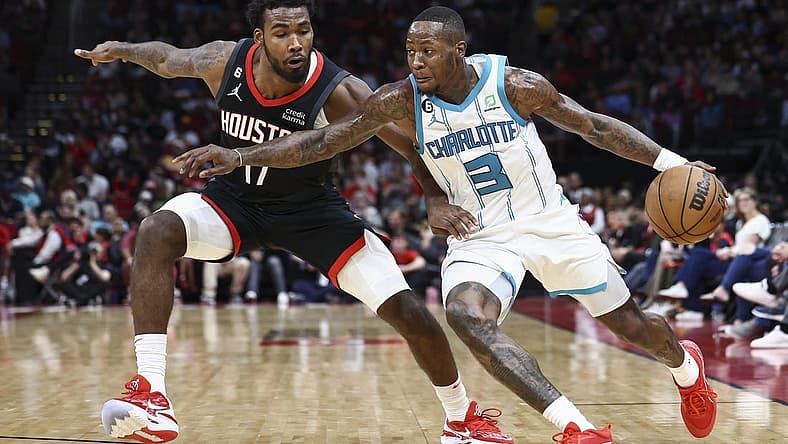 Jan 18, 2023; Houston, Texas, USA; Charlotte Hornets guard Terry Rozier (3) controls the ball as Houston Rockets forward Tari Eason (17) defends during the third quarter at Toyota Center. Mandatory Credit: Troy Taormina-USA TODAY Sports