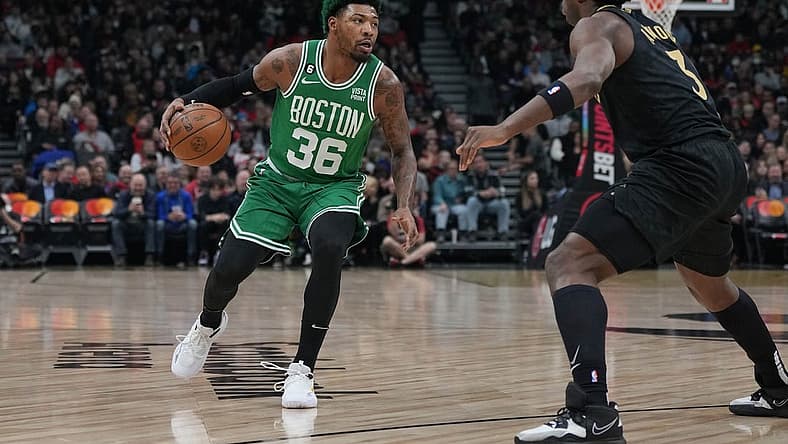 Jan 21, 2023; Toronto, Ontario, CAN; Boston Celtics guard Marcus Smart (36) controls the ball asToronto Raptors forward O.G. Anunoby (3) tries to defend during the first quarter at Scotiabank Arena. Mandatory Credit: Nick Turchiaro-USA TODAY Sports