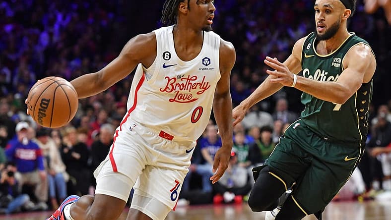 Feb 25, 2023; Philadelphia, Pennsylvania, USA; Philadelphia 76ers guard Tyrese Maxey (0) drives to the basket against Boston Celtics guard Jaylen Brown (7) at Wells Fargo Center. Mandatory Credit: Eric Hartline-USA TODAY Sports
