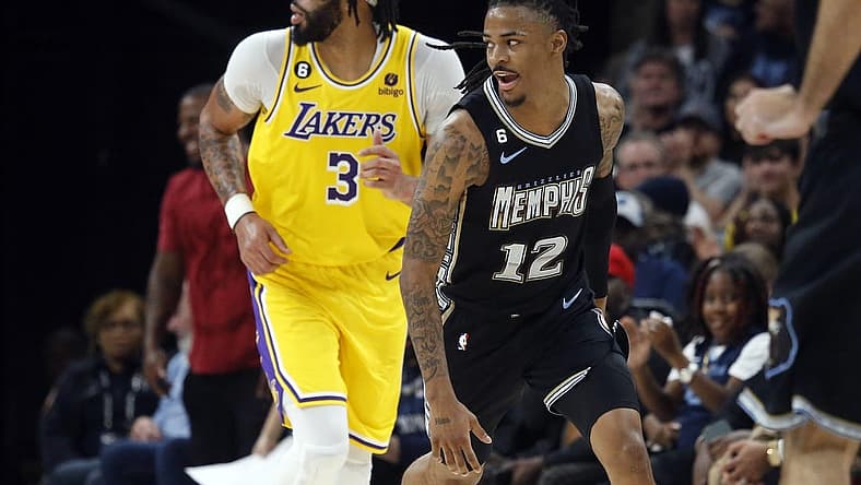 Feb 28, 2023; Memphis, Tennessee, USA; Memphis Grizzlies guard Ja Morant (12) reacts during the second half against the Los Angeles Lakers at FedExForum. Mandatory Credit: Petre Thomas-USA TODAY Sports
