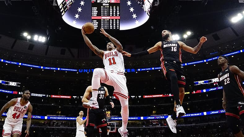 Mar 18, 2023; Chicago, Illinois, USA; Miami Heat forward Caleb Martin (16) defends Chicago Bulls forward DeMar DeRozan (11) during the second half at United Center. Mandatory Credit: David Banks-USA TODAY Sports