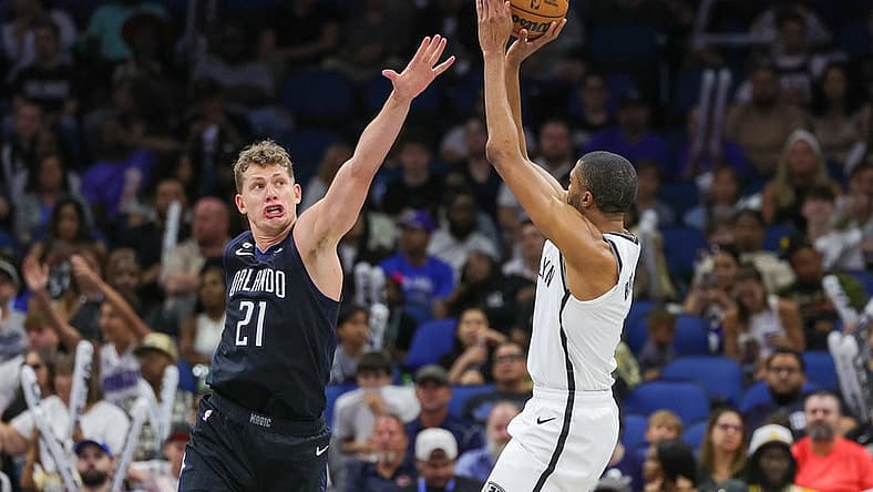 Mar 26, 2023; Orlando, Florida, USA; Brooklyn Nets forward Mikal Bridges (1) shoots the ball against Orlando Magic center Moritz Wagner (21) during the second half at Amway Center. Mandatory Credit: Mike Watters-USA TODAY Sports
