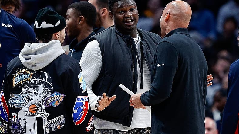 Mar 30, 2023; Denver, Colorado, USA; New Orleans Pelicans forward Zion Williamson (C) talks with guard Jose Alvarado (L) and assistant coach Fred Vinson (R) in the second quarter against the Denver Nuggets at Ball Arena. Mandatory Credit: Isaiah J. Downing-USA TODAY Sports