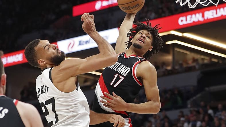Apr 2, 2023; Minneapolis, Minnesota, USA; Portland Trail Blazers guard Shaedon Sharpe (17) looks to dunk on Minnesota Timberwolves center Rudy Gobert (27) in the first quarter at Target Center. Mandatory Credit: Bruce Kluckhohn-USA TODAY Sports