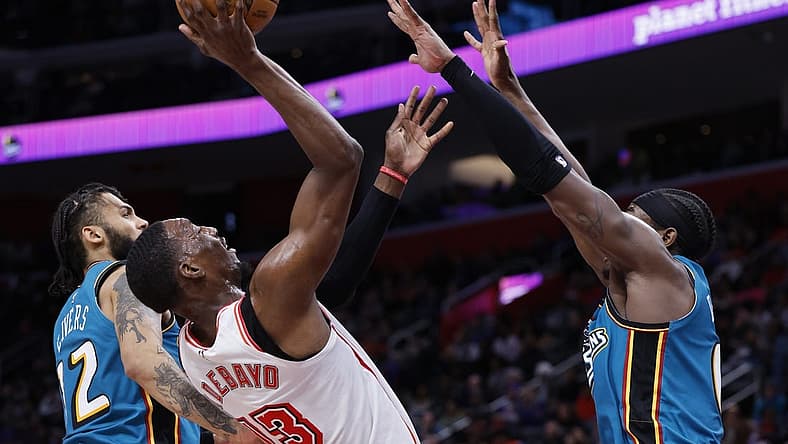 Apr 4, 2023; Detroit, Michigan, USA; Miami Heat center Bam Adebayo (13) shoots on Detroit Pistons center Jalen Duren (0) in the first half at Little Caesars Arena. Mandatory Credit: Rick Osentoski-USA TODAY Sports
