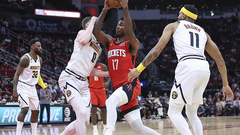 Apr 4, 2023; Houston, Texas, USA; Houston Rockets forward Tari Eason (17) drives with the ball as Denver Nuggets guard Christian Braun (0) defends during the second quarter at Toyota Center. Mandatory Credit: Troy Taormina-USA TODAY Sports