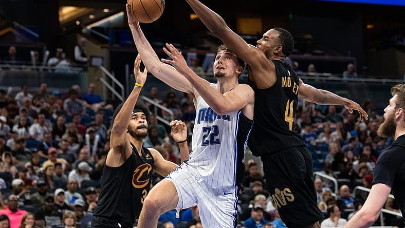 Apr 4, 2023; Orlando, Florida, USA; Orlando Magic forward Franz Wagner (22) shoots the ball against Cleveland Cavaliers forward Evan Mobley (4) in the fourth quarter at Amway Center. Mandatory Credit: Jeremy Reper-USA TODAY Sports