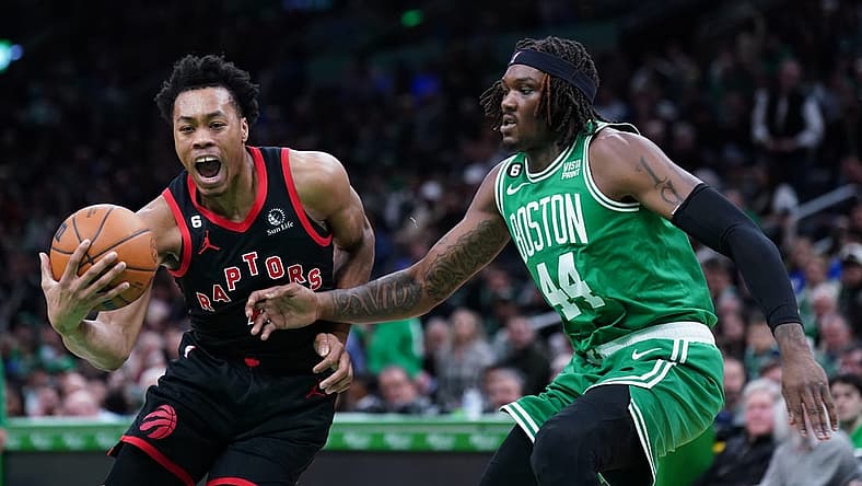 Apr 5, 2023; Boston, Massachusetts, USA; Toronto Raptors forward Scottie Barnes (4) drives the ball against Boston Celtics center Robert Williams III (44) in the second quarter at TD Garden. Mandatory Credit: David Butler II-USA TODAY Sports